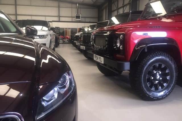 The dealership specialises in sports cars and 4x4 vehicles.