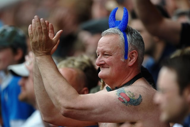 A Chesterfield fan cheers his team out during the League Two match between Chesterfield and Gillingham in 2011 as Spireites won the league.