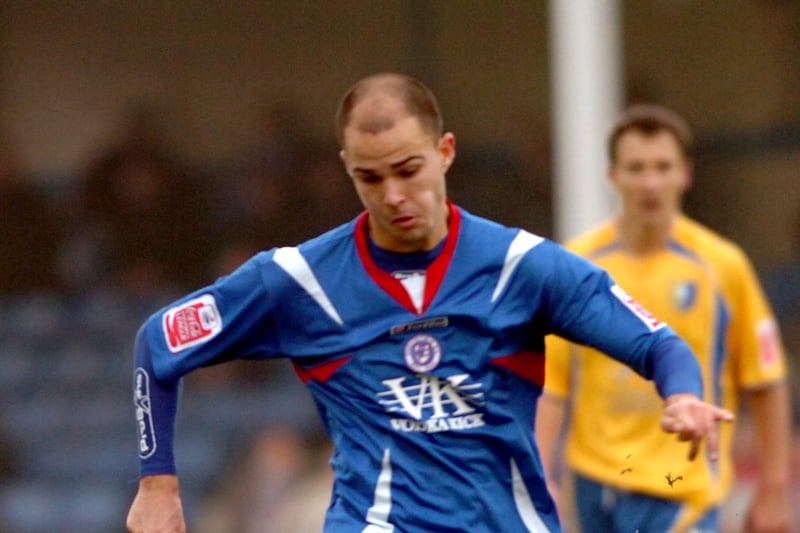 Phil Pickin clears the ball. The defender joined the club on 25 May 2006 on a permanent basis after a successful loan spell.