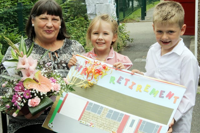 Secretary Lilian Butterworth retires from Clowne Infants School and is thanked by Alex Smyth and Scott Johnston.