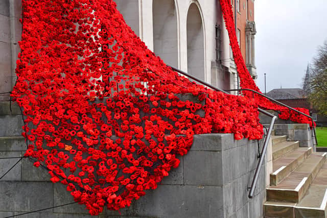 Chesterfield Town Hall after has been decorated with a cascade of thousands of woollen poppies knitted and crocheted by local residents.