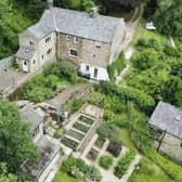 The property on Lumb Lane, Darley Dale is set on a 1.5-acre plot alongside ancient woodland.