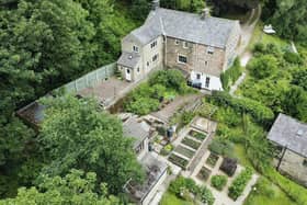 The property on Lumb Lane, Darley Dale is set on a 1.5-acre plot alongside ancient woodland.