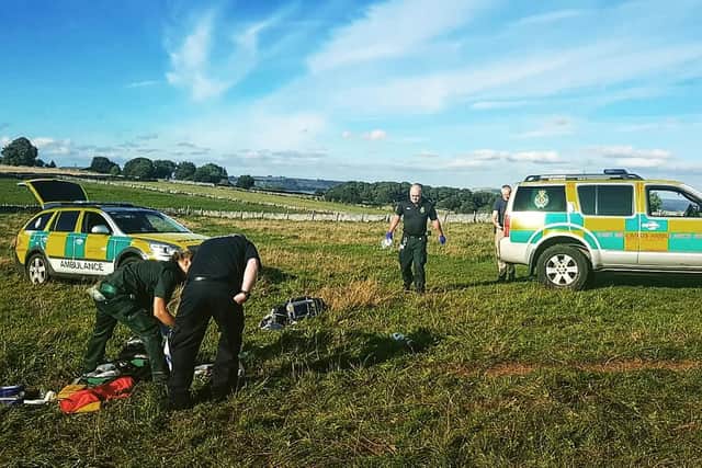 Emergency services attend the scene where Pip Peacock was attacked by the herd of cows.