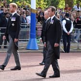 James had a front row view of the Royal family. Prince William, Prince of Wales, Prince Harry, Duke of Sussex and Peter Phillips walk behind the coffin during the procession for the Lying-in State of Queen Elizabeth II.