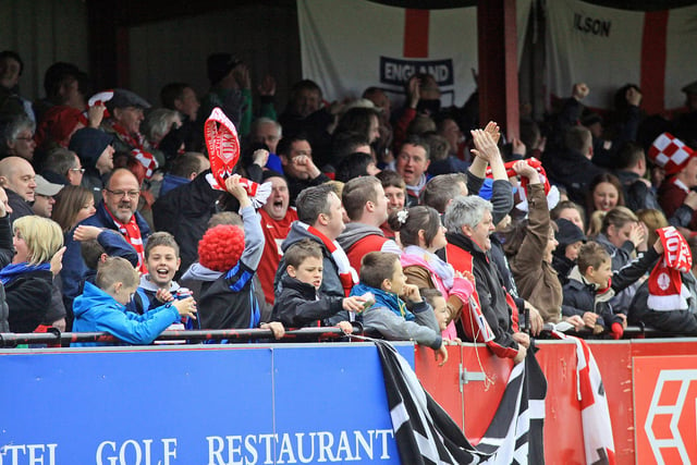 Ilkeston fans celebrate after the second goal.