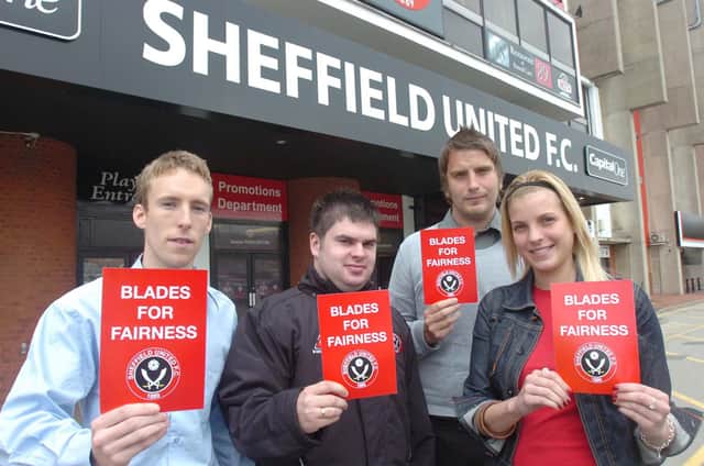 Pictured at Sheffield United are fans with Blades for Fairness posters: Jonny Hall, Mark Woollas, Daniel Scott, and Lisa Eklid.