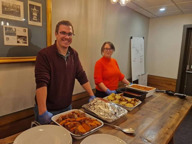 Tom Grazier and Rachel Ollier from Lubrizol serving the meal