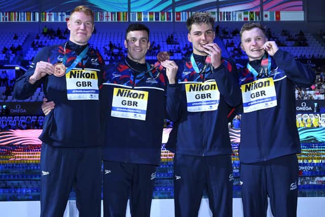 Jacob Whittle (third from left) poses with his Team GB team-mates James Guy, Joe Litchfield and Tom Dean after their bronze medal in Budapest. Photo: Getty.
