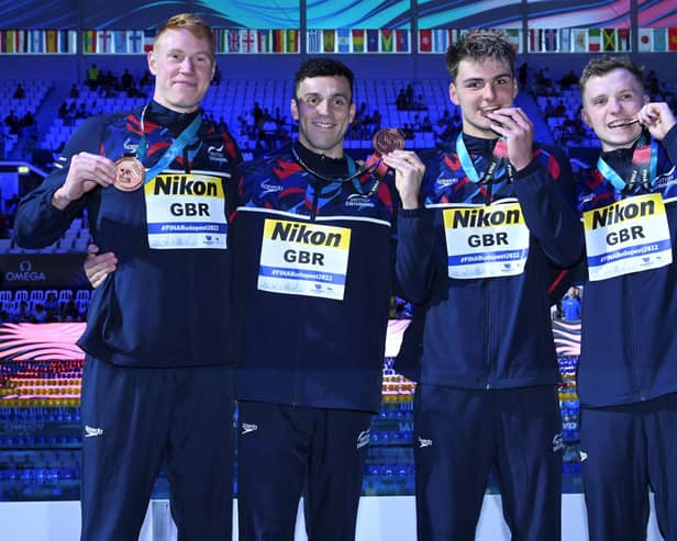 Jacob Whittle (third from left) poses with his Team GB team-mates James Guy, Joe Litchfield and Tom Dean after their bronze medal in Budapest. Photo: Getty.