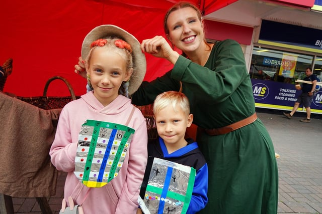 Jessica Woodhead from Chesterfield museum showing Jessica and Isaac Kirkwood some medieval items.