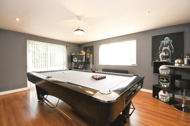 The games room makes an excellent entertaining space with pool table and doors leading to the outside.
