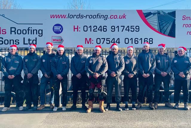 Liam Anderson, centre, with his employees at Lords Roofing & Sons Ltd.