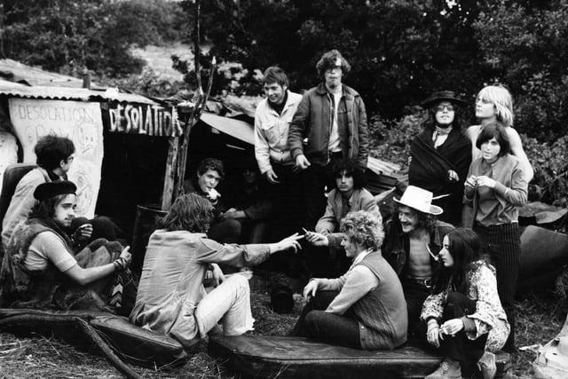 A group of hippies talk and smoke marijuana outside their camp at the Isle of Wight pop festival.    (Photo by Evening Standard/Getty Images)