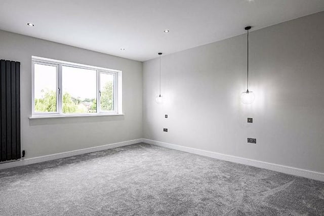 On the first floor there is a master bedroom with a walk-in wardrobe and en-suite shower room, three further double bedrooms, and a single bedroom.