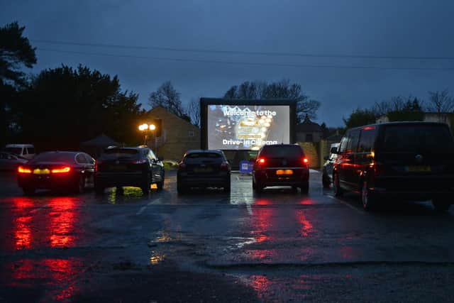 Cars start to arrive for the show at Brampton Manor's drive-in cinema.