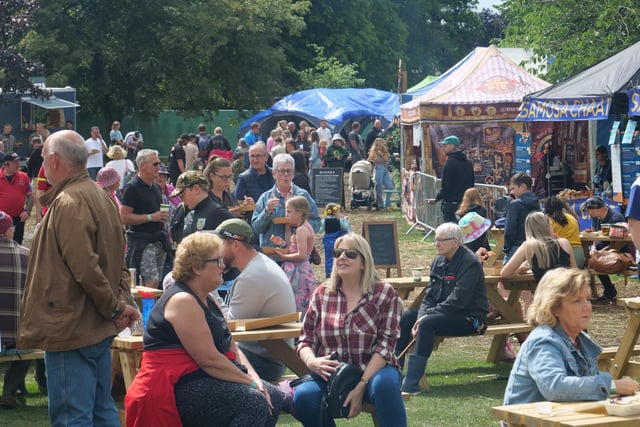 Crowds take in the atmosphere and enjoy the food on offer.