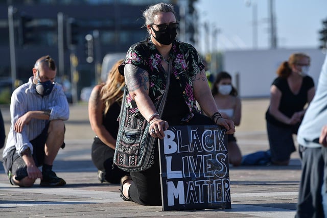 A Sunderland Unite member holds her message board during the Black Lives Matter vigil held in Keel Square.