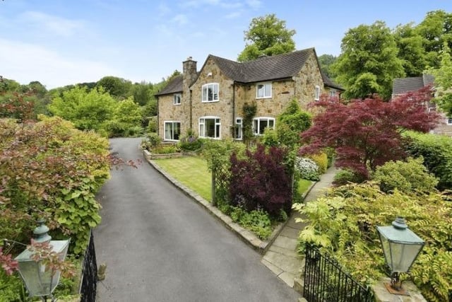 The four-bedroom detached house at Coombs Road, Bakewell, has a long driveway that winds through the gardens.