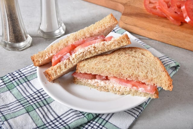 Christine Griffin posted: "Squashy tomato sandwiches wrapped in damp greaseproof paper in a metal sandwich tin.
