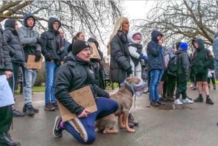 Dog owners listen to the speeches at Queen's Park, Chesterfield.