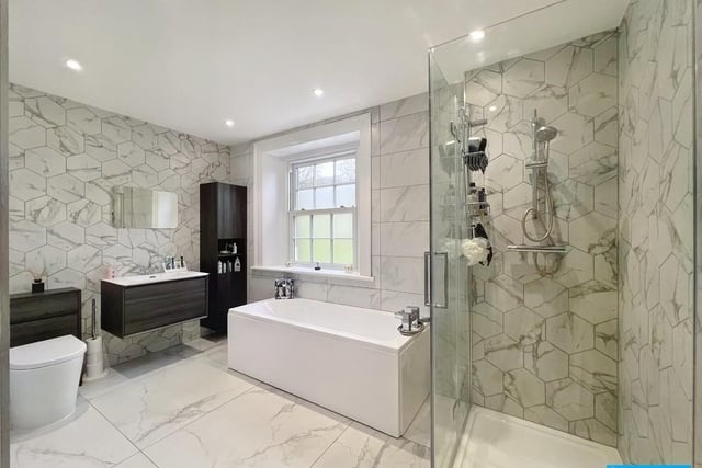 This fully tiled room contains bath, separate shower cubicle with mixer shower, wash basin and wc.