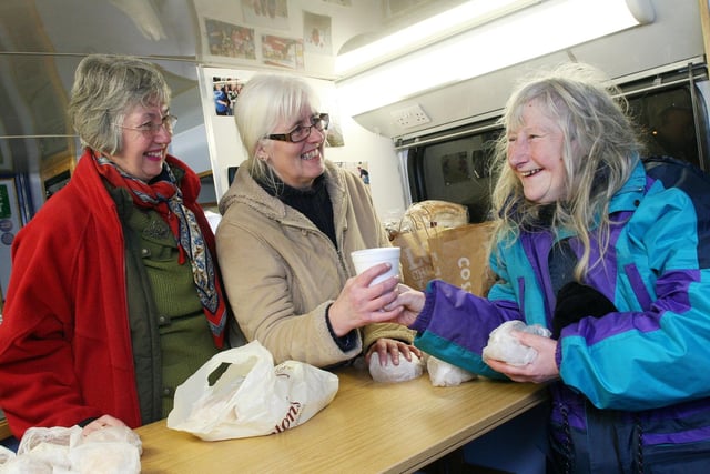 Barbara Newton and Ann Leblanc served food and soup to Linda Banks on the Church on the Bus in Matlock in 2010.