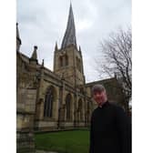 Reverend Patrick Coleman outside Chesterfield's Crooked Spire church.