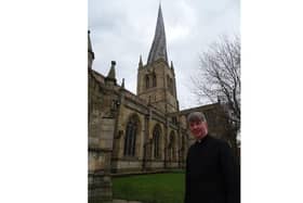 Reverend Patrick Coleman outside Chesterfield's Crooked Spire church.