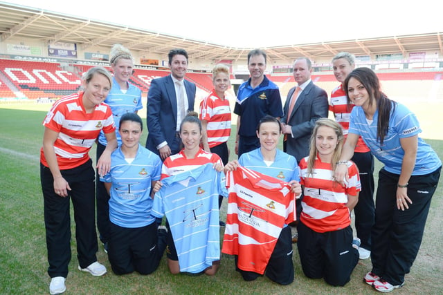 Doncaster Rovers Belles celebrate their three year sponsorship deal with Innovation Financial Services Ltd. Pictured back l-r are Katie Holtham, Millie Bright, Hugh McAuley, of Innovation Financial Services, Sue Smith, Belles manager John Buckley, Stewart Groves, of Innovation Financial Services, Tanya Oxtaby, and Tania Pedron. Front l-r are Jessica Sigsworth, Alyssa Lagonia, Aine O'Gorman, and Julie-Ann Russell.  Picture: Liz Mockler D2366LM