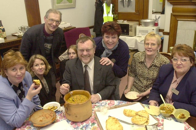 Coun Peter Moore and Town Hall staff tucked into a home made curry in his office..to raise money for Breast Cancer research in March 2001