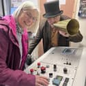 Joanna Brown pushes the green button to launch the cable car season, watched by living history actor David Oxley who plays her great-great-great grandfather Benjamin Bryan at the award-winning tourist attraction.