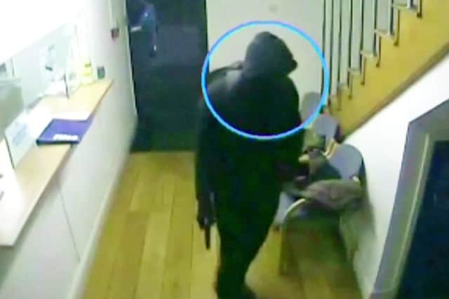 CCTV of the horrifying moment masked raiders ambushed a cash and carry - just minutes before they tied up the staff and shot the company director, Akhtar Javeed, at point blank range.