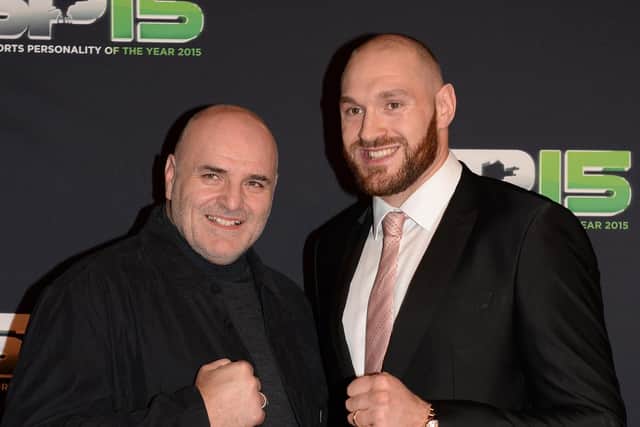 Tyson Fury and his father John pose on the red carpet before the BBC Sports Personality of the Year award.