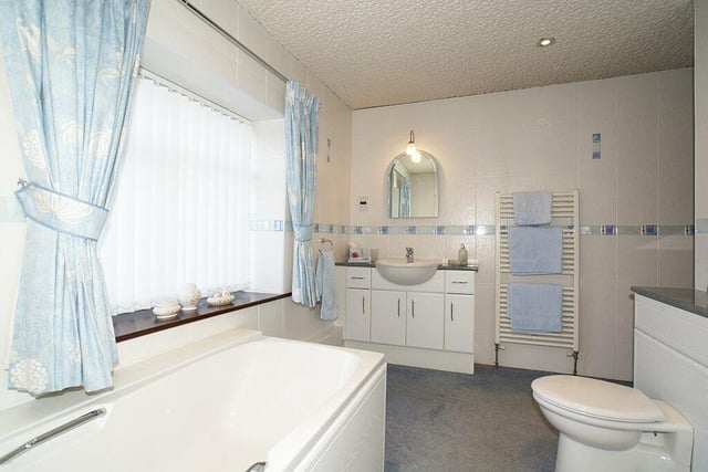 The family bathroom contains a bath with mixer tap and handheld shower spray, semi-countertop wash basin with storage cupboards beneath and an illuminated mirror over, and a wc. A recently fitted gas fired boiler is housed in an airing cupboard.