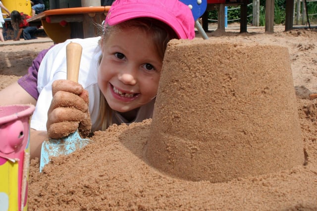 Tamsin Worthy, aged 6, enjoys playing in the sand pit at Queen's Park, Chesterfield, in 2009