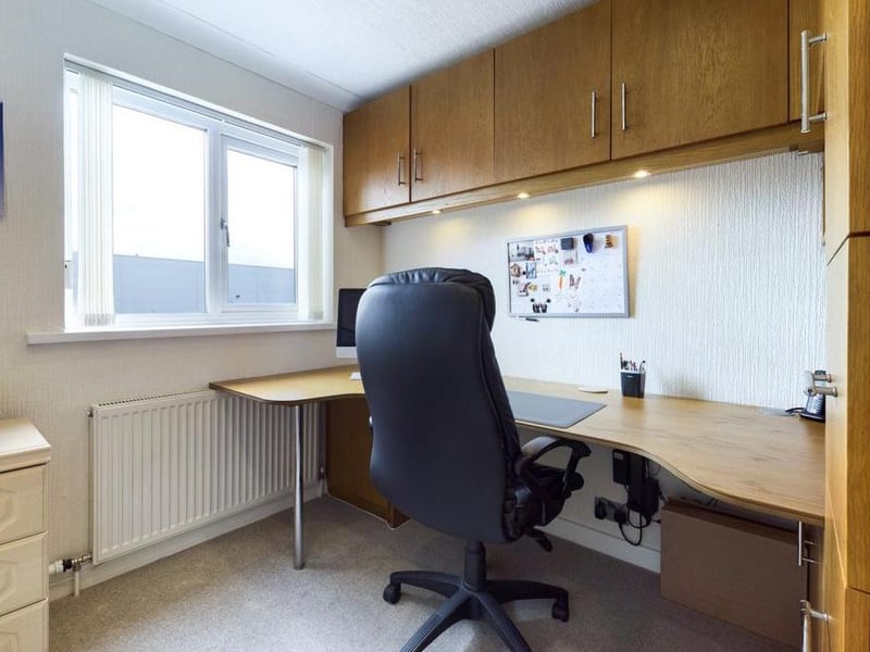 Bedroom 3 - presently used as a study uPVC a range of fitted cupboards to two walls..