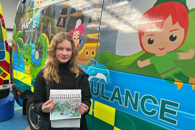 Hollie Pointon with the fleet of ambulances she designed for transporting sick children to Great Ormond Street Hospital.