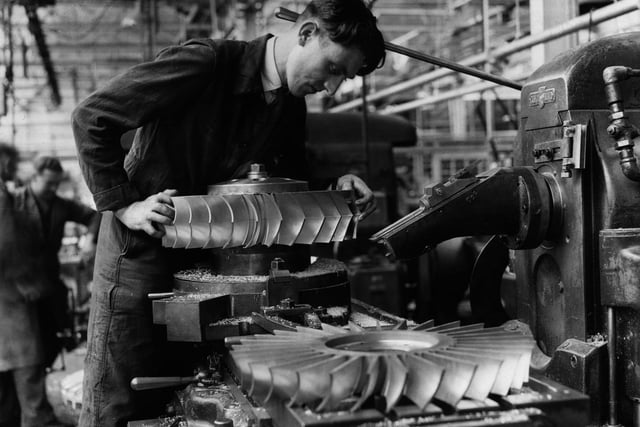 A worker at the Rolls Royce factory in Derby in 1947 finishing a pari of rotating guide vanes for a 'nene' jet engine.  (Photo by Central Press/Getty Images)