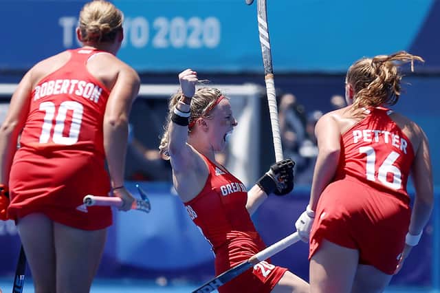 Hollie Pearne-Webb celebrates scoring Team GB's third goal with Sarah Robertson and Isabelle Petter during the women's bronze medal match between Great Britain and India. (Photo by Clive Mason/Getty Images)