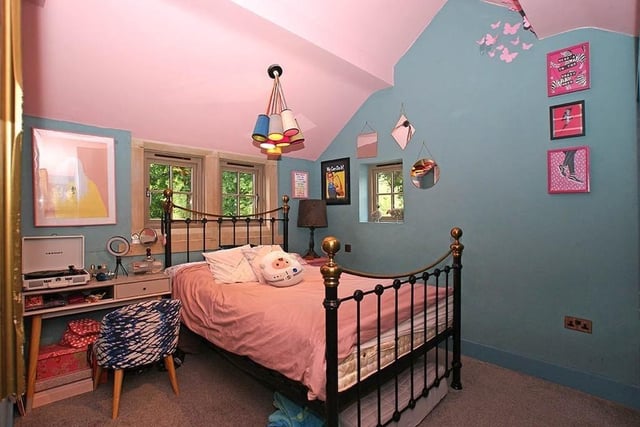 Colourfully decorated bedroom for a young resident of the house.