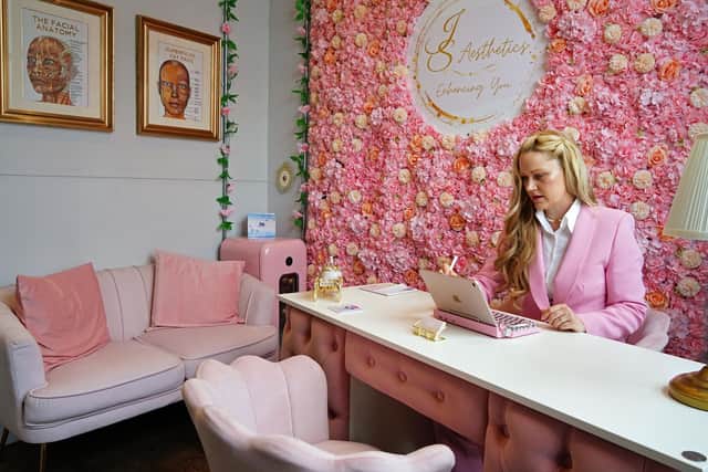 Jesse has put a feminine accent on the clinic's decor with lots of pink and gold in the furnishings.