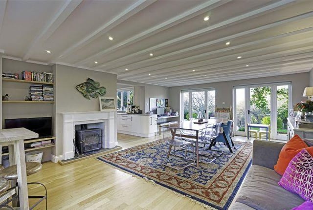 The kitchen leads through into a spacious and relaxed dining room, which also has direct access out into the garden.