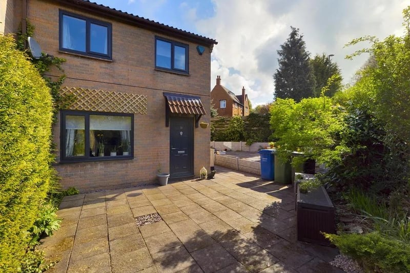 Offers in the region of £170,000 are invited by estate agent Hunters for this three-bedroom end townhouse, with gardens to three sides.