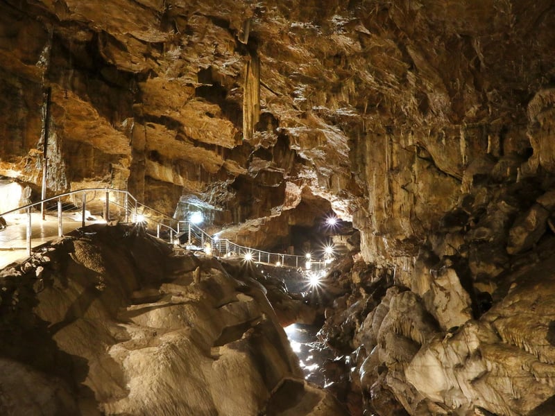 Limestone Pooles Cavern in Buxton Country Park welcomes visitors with breathtaking crystal stalactites that have been lining the chambers for millions of years. It is surrounded by beautiful woodland trails leading to to a panoramic Peak District hilltop viewpoint.