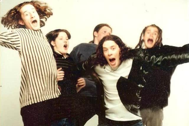 Aaron Brown, front, with Dazy Age musicians.