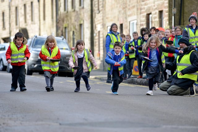 Locals have fun at the annual Winster Pancake Race.