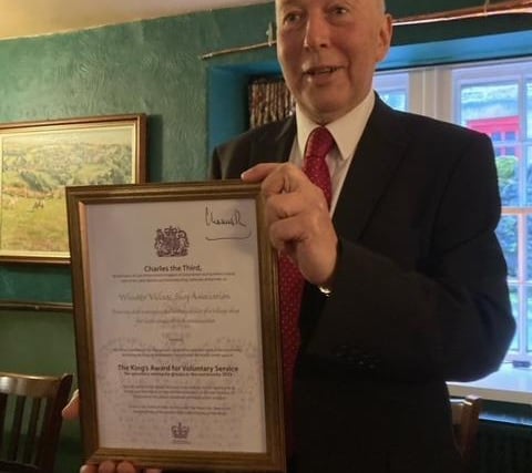 Alistair Wright with the KAVS certificate signed by the King.