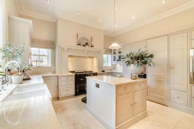 The kitchen has an array of fitted contemporary shaker style units offering an abundance of storage and there is an electric Aga. A feature of this room is an indoor well that is fitted with a glass cover and is prominent within the tiled floor.