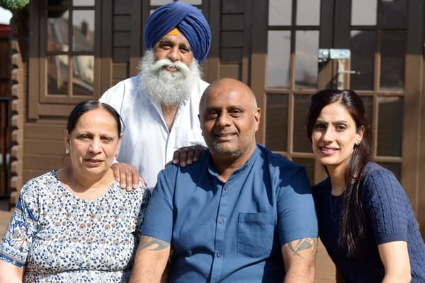 Post Office worker Harjinder Butoy (middle) was wrongly accused of stealing thousands of pounds but his conviction has now been overturned. He is pictured with his mum Satya Devi, dad Kesar Singh and wife Balbinder Butoy. Picture by Brian Eyre.